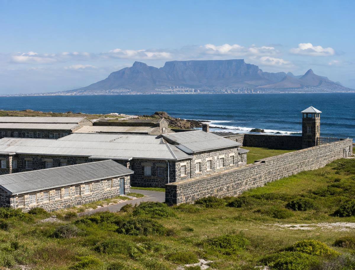 Historic buildings on Robben Island with Table Mountain across Table Bay